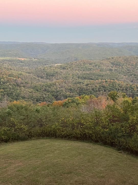 The forested Allegheny ridgeline view from the top of the observation tower at Droop Mountain Battlefield State Park, at dusk