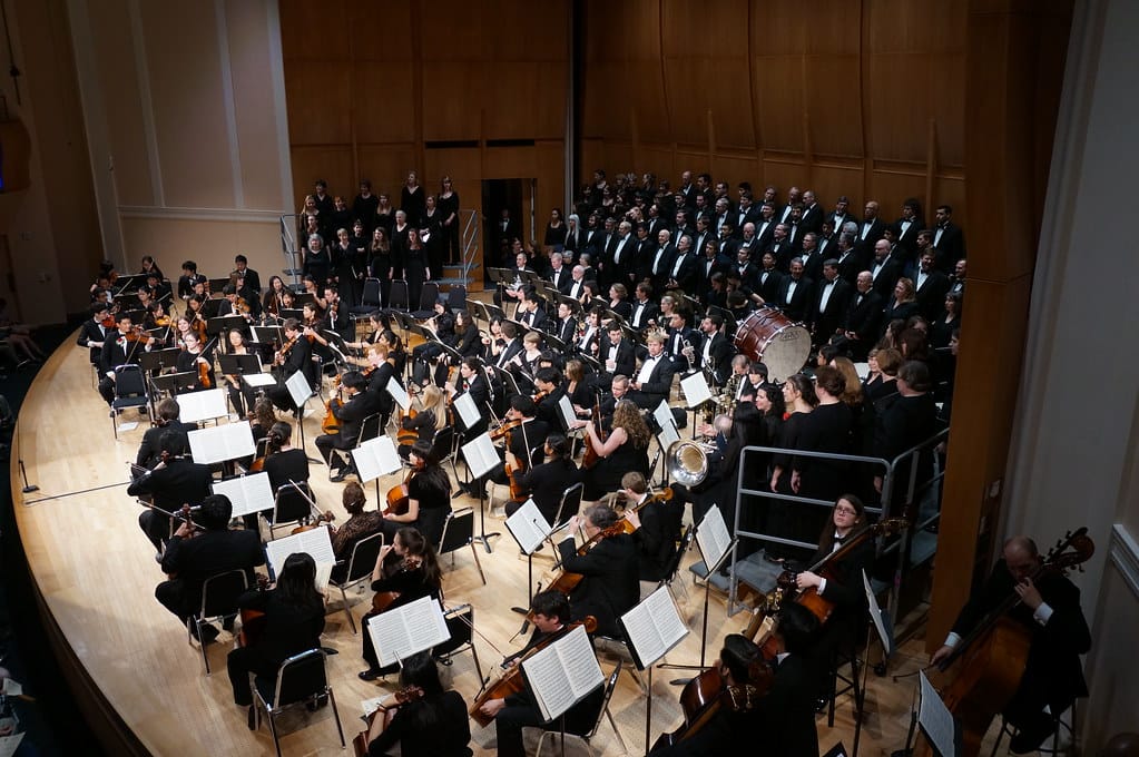 The massed forces of Duke Symphony Orchestra, Duke Chorale, members of the Choral Society of Durham, and soloists Andrea Moore, soprano; Elizabeth Tredent, alto; Timothy Culver, tenor; Brian Johnson, baritone.