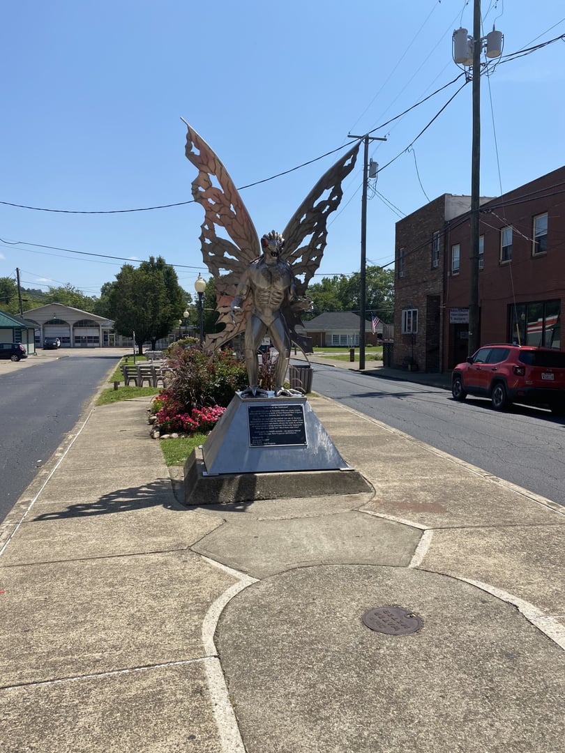 Polished stainless-steel Mothman statue in downtown Point Pleasant West Virginia