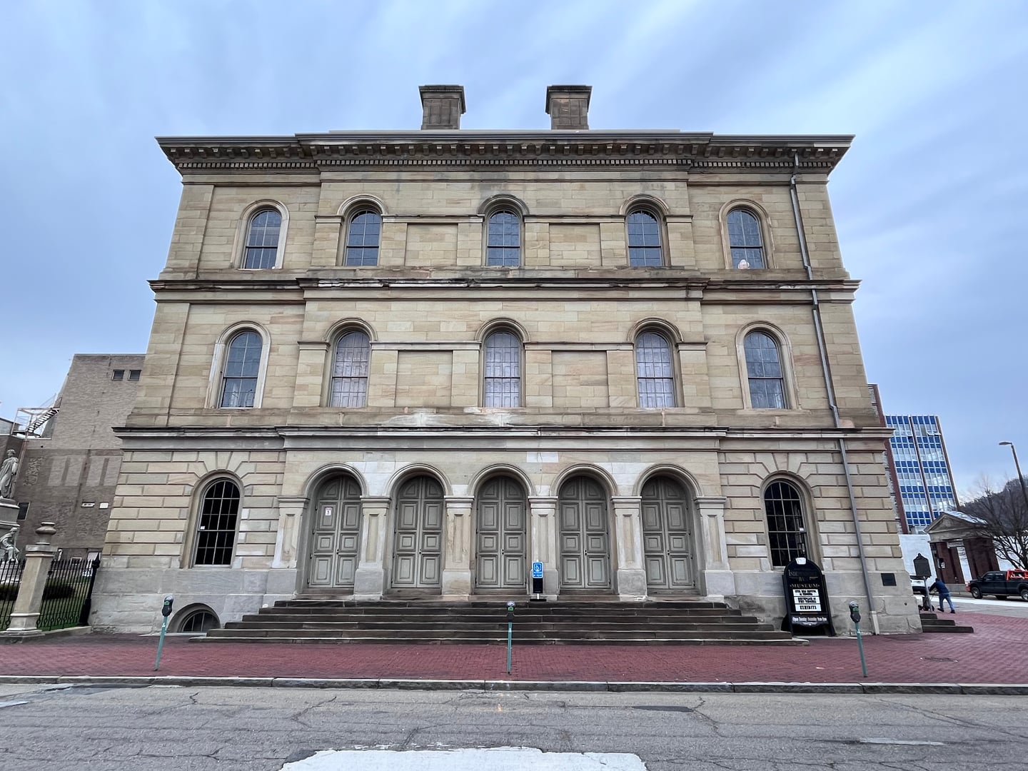 Italianate sandstone facade of West Virginia Independence Hall on Market Street in Wheeling