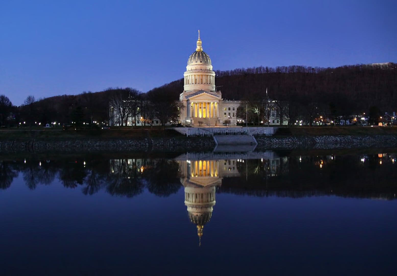The gold dome of the West Virginia State Capitol on the Kanawha River in Charleston