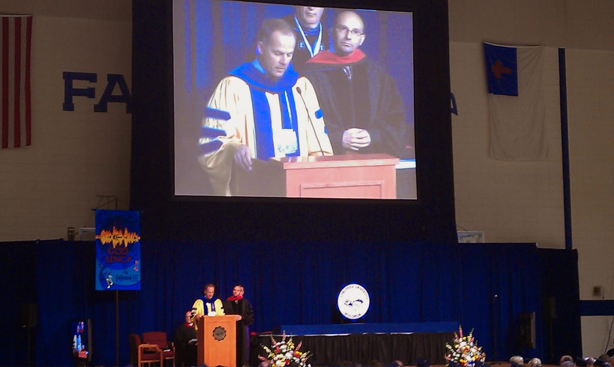 in the field house of the university, the President of the University Patrick Ferry speaks