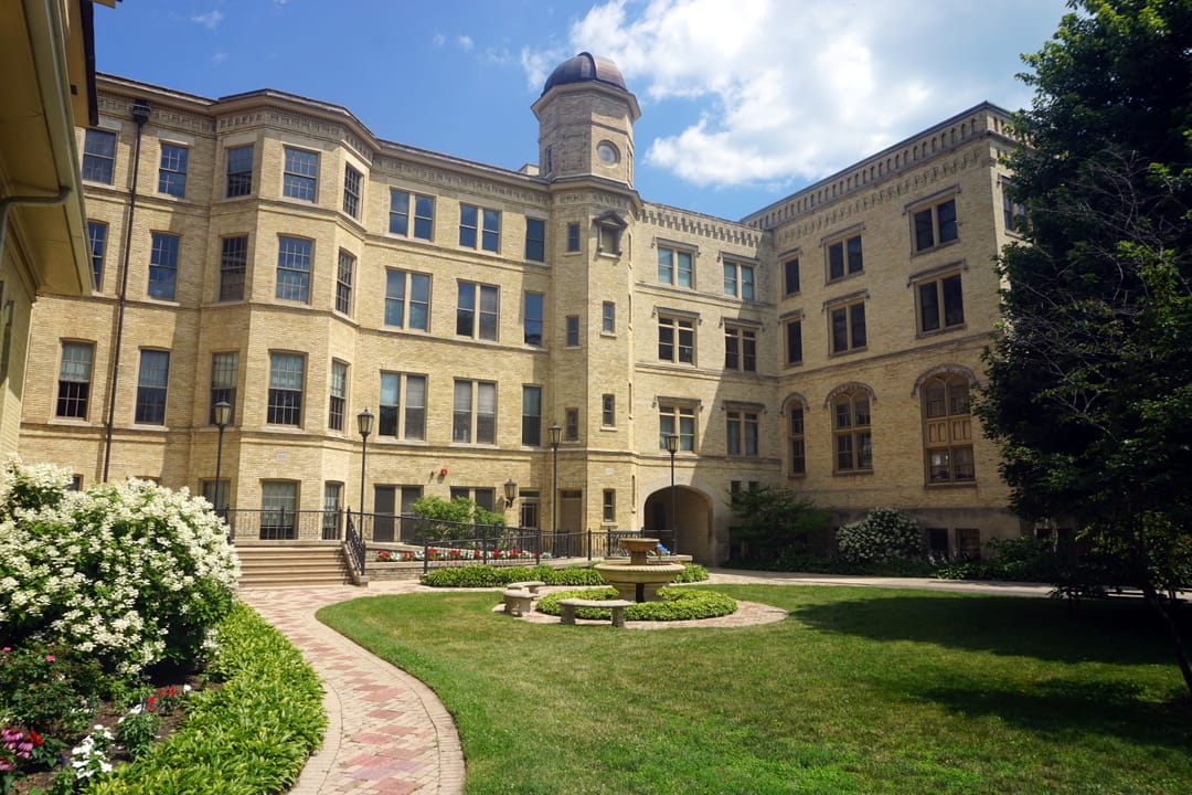 Exterior of Kemper Hall at Kemper Center on the Lake Michigan shoreline in Kenosha, Wisconsin, listed on the National Register of Historic Places