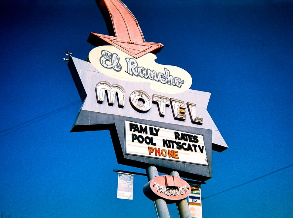 Mesa signage: El Rancho Motel, includes pool, cable TV, and a phone.