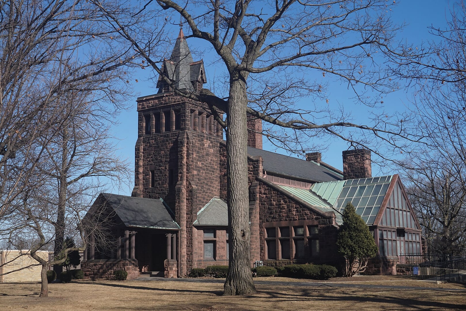 The Landmark Chapel at Forest Home Cemetery in Milwaukee, Wisconsin, designed by George Ferry and Alfred Clas and built beginning in 1890, surrounded by snow-covered grounds