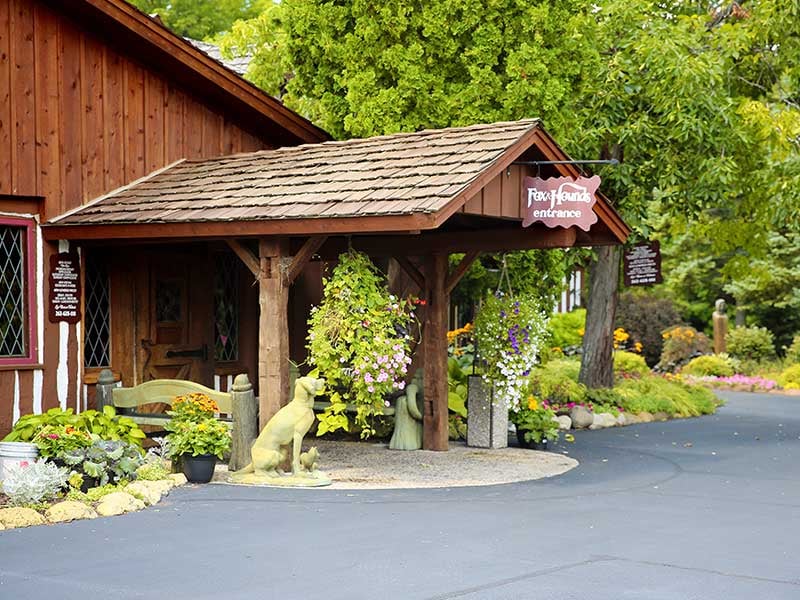 Exterior of Fox and Hounds Restaurant in Hubertus Wisconsin, built around an 1845 log cabin in the Kettle Moraine near Holy Hill