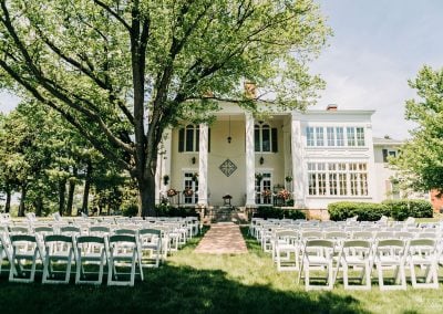 Exterior of the 1857 Ludlow Mansion in Monroe, Wisconsin, with rooftop widow's walk
