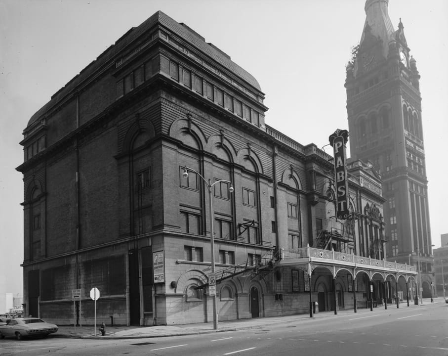 The Pabst Theater in 1970, in a black-and-white Historic American Buildings Survey photo showing its corner facade and marquee