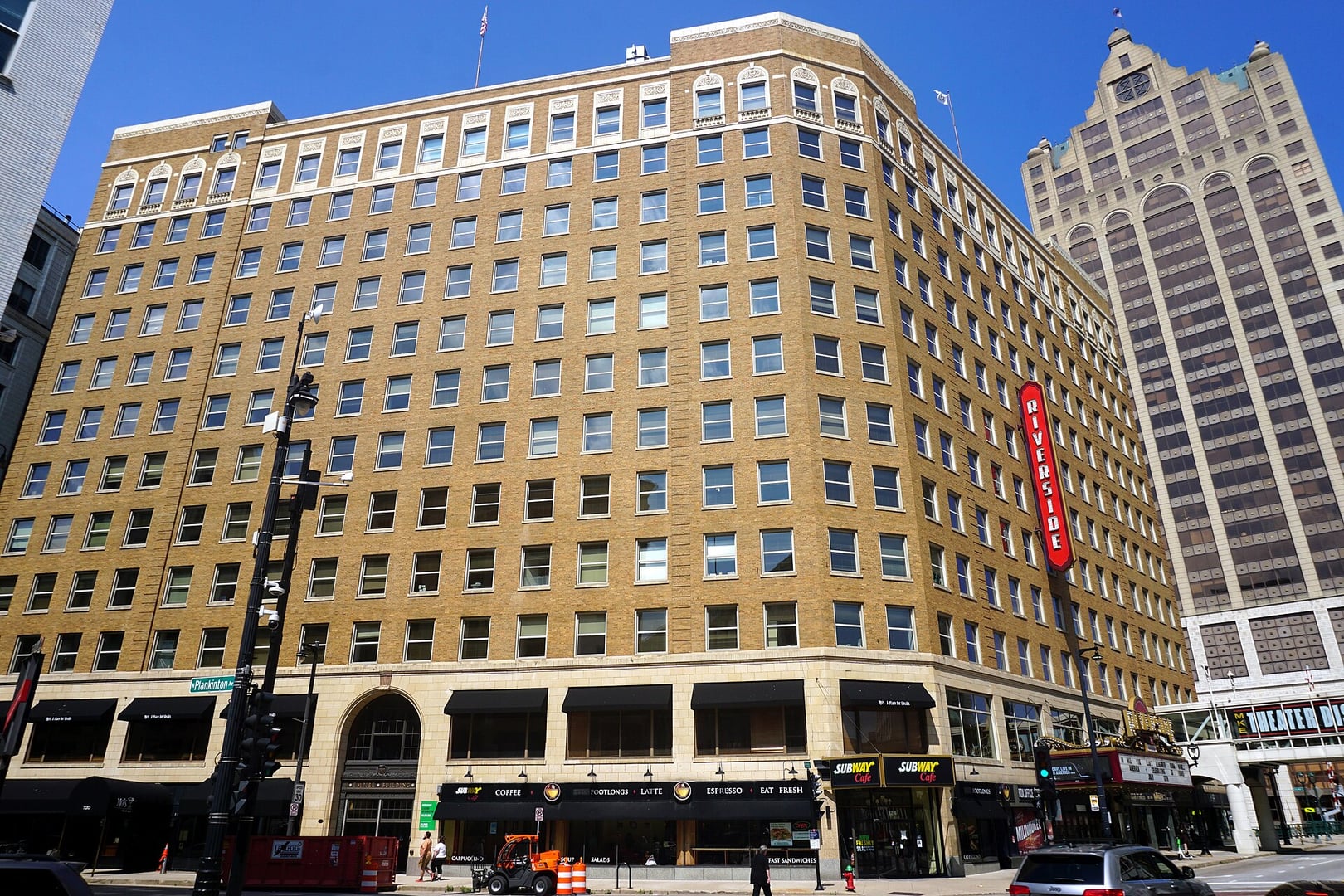The Empire Building and Riverside Theater on West Wisconsin Avenue in downtown Milwaukee, Wisconsin, photographed in July 2023