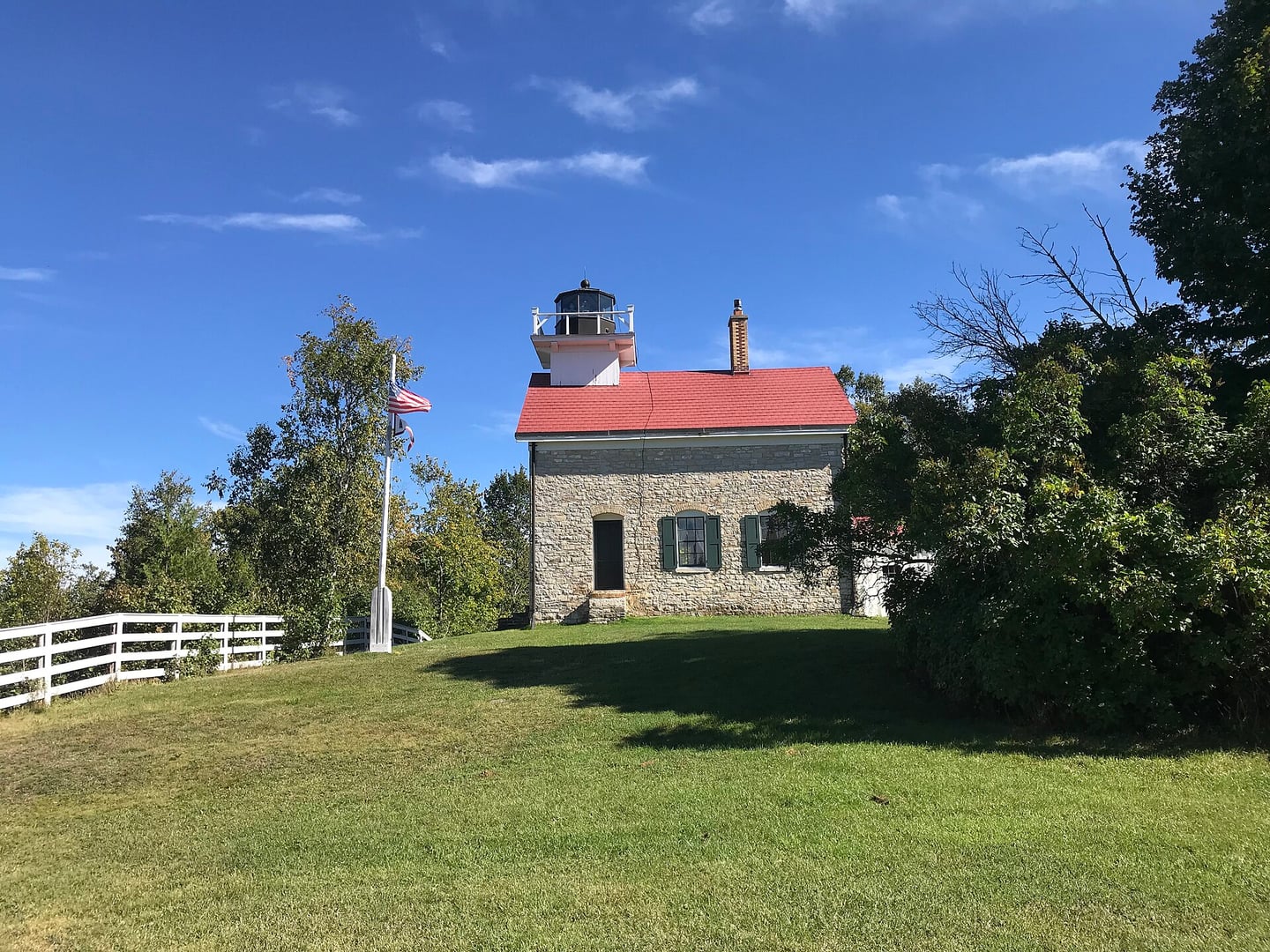 Pottawatomie Lighthouse on Rock Island, Door County, Wisconsin — Wisconsin's oldest lighthouse, 1858 limestone structure viewed from the west