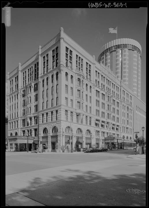 HABS (Historic American Buildings Survey, HABS WI-363) documentation photo of the Hotel Pfister's Wisconsin Avenue corner, with a later highrise visible behind the 1893 building -- a different-era companion to the current hero photo of the same corne