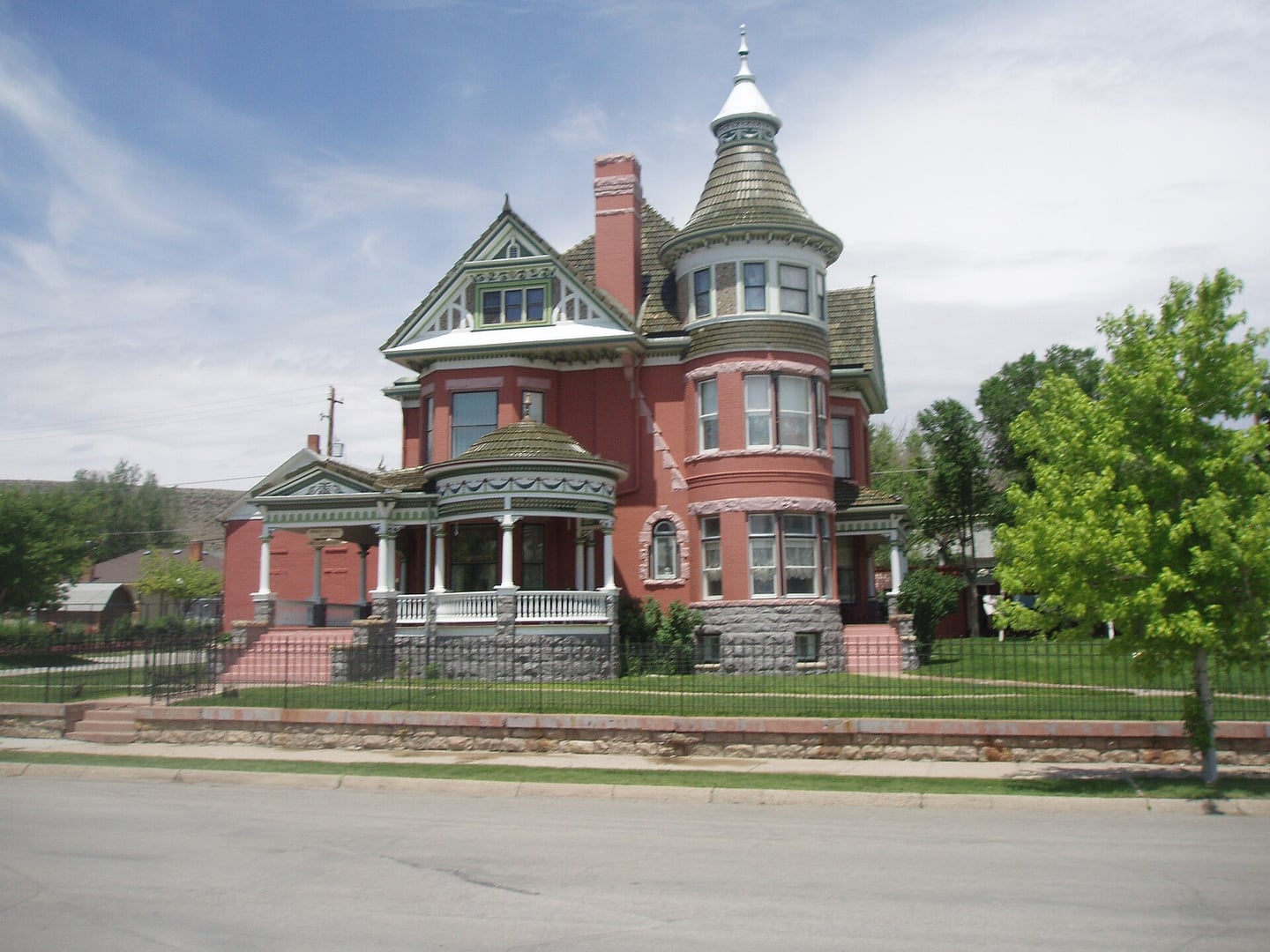 Exterior view of the George Ferris Mansion at 607 West Maple Street in Rawlins, Wyoming, a 1903 Queen Anne residence with a turret and ornate Victorian woodwork