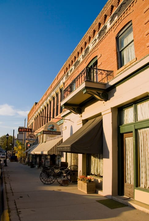 The Occidental Hotel's street-side facade in Buffalo, Wyoming, with a horse-drawn carriage parked outside, 2007.