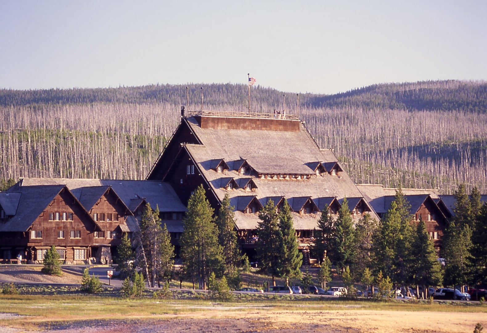 Main facade of Old Faithful Inn at Yellowstone National Park, Wyoming, showing the log-and-rhyolite exterior designed by Robert Reamer in 1903