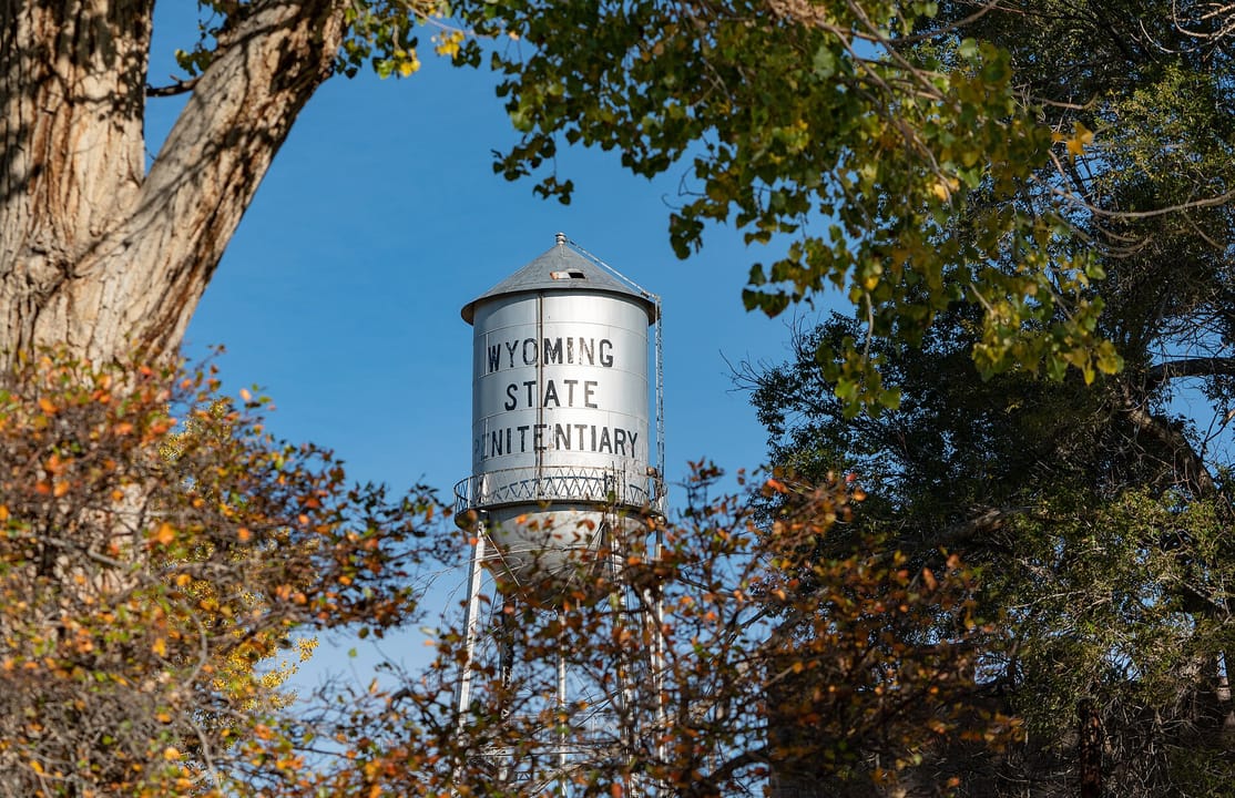 The old water tower on the prison grounds, lettered 'WYOMING STATE PENITENTIARY', Rawlins, Wyoming.